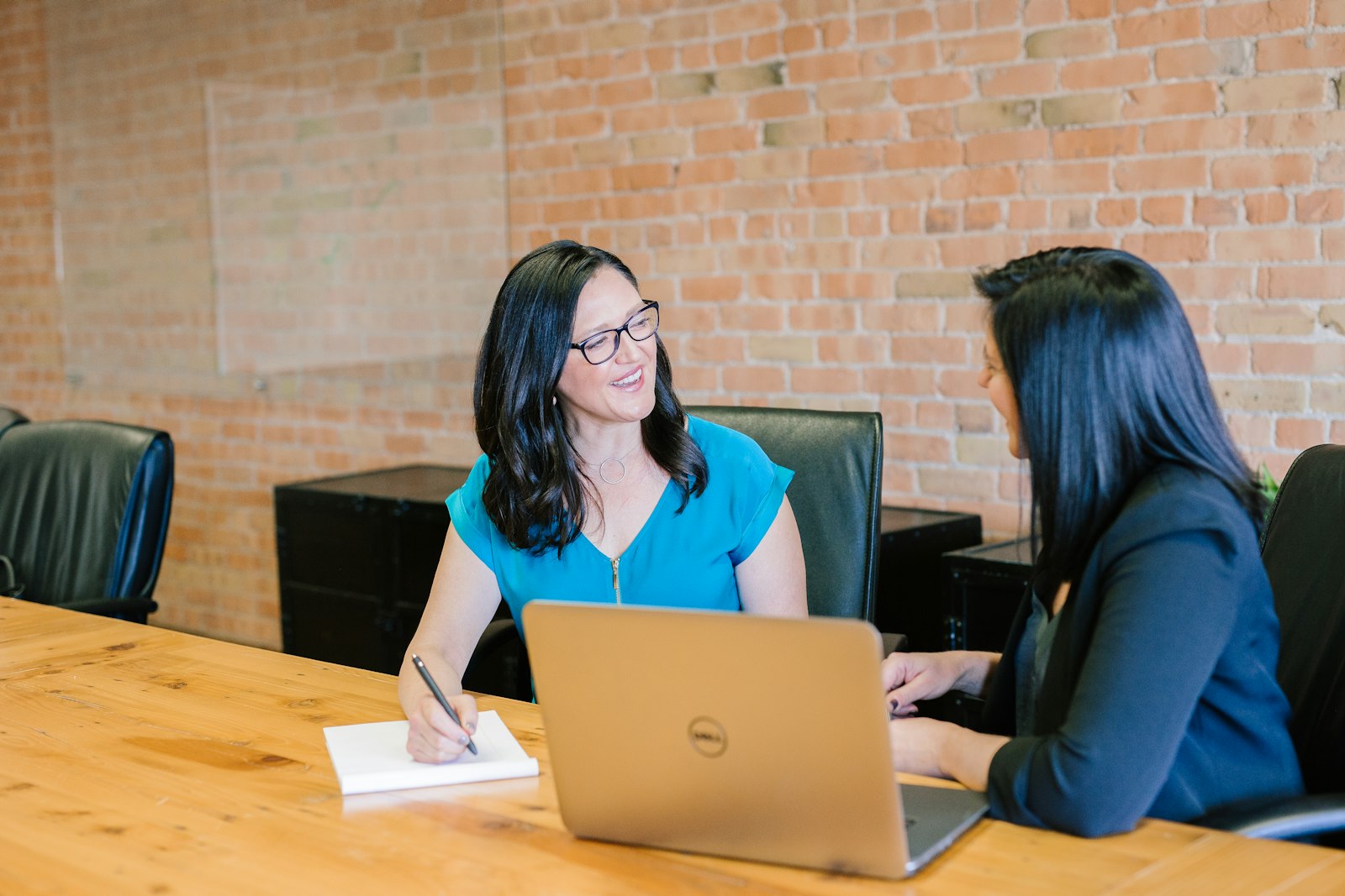 Consultant meeting with a small business client about government contracts