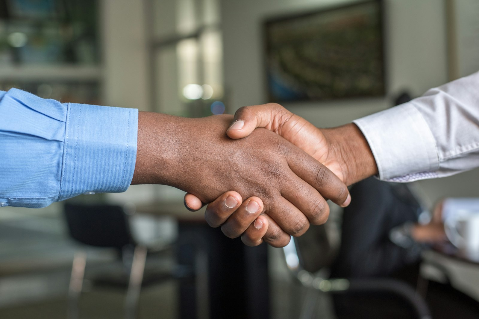 Business handshake between a prime contractor and a certified small business