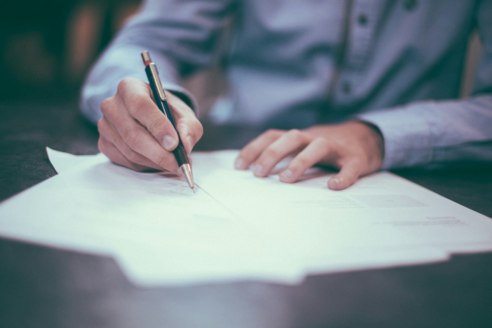 Signing a government contract with a pen